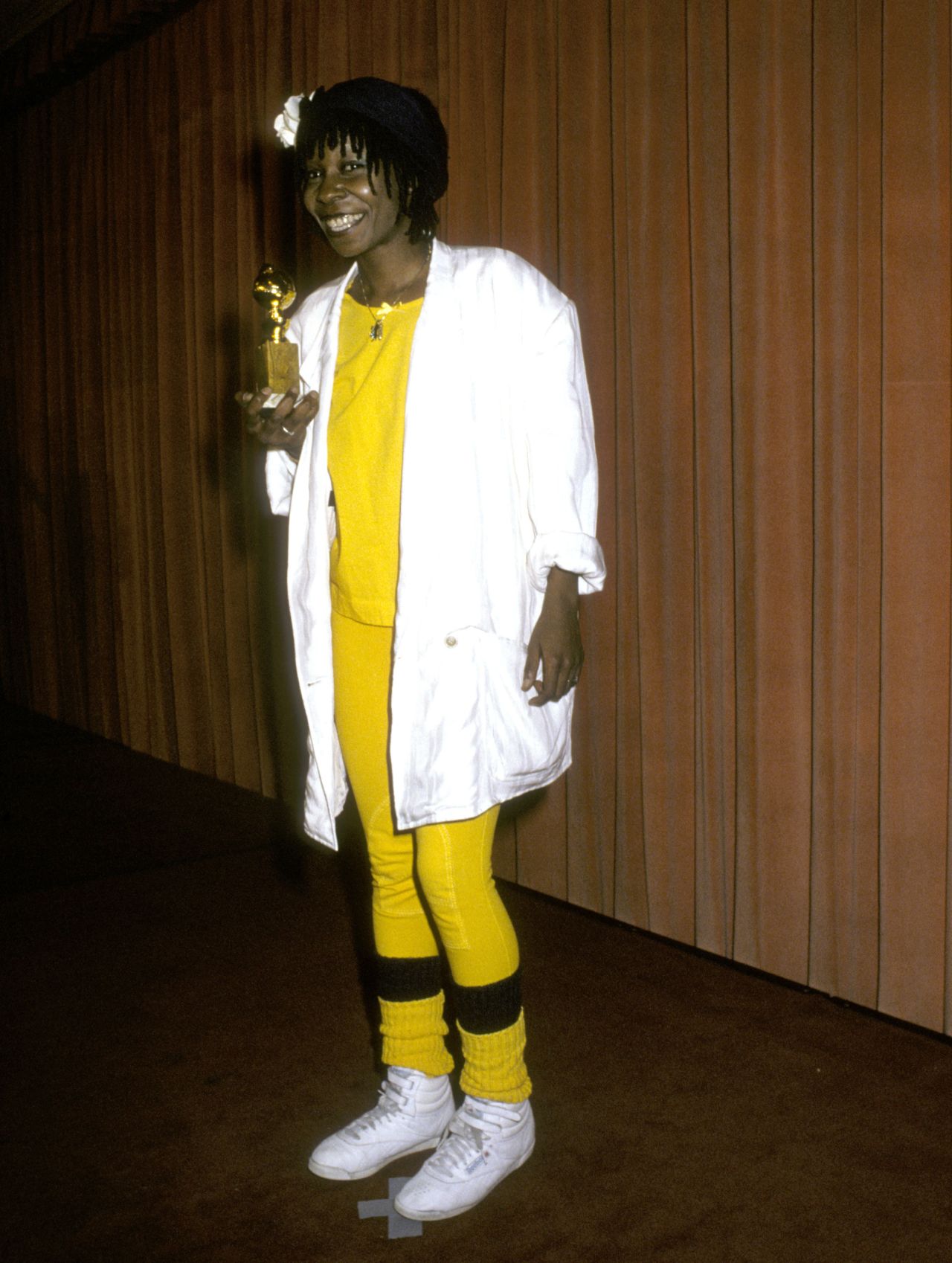 W is for Whoopi: Whoopi Goldberg took home a Golden Globe in 1986 for her performance in "The Color Purple." And she secured her place in the awards' fashion history with one of the red carpet's oddest looks, combining a white blazer with yellow leggings, leg-warmers and a pair of white Reebok sneakers.