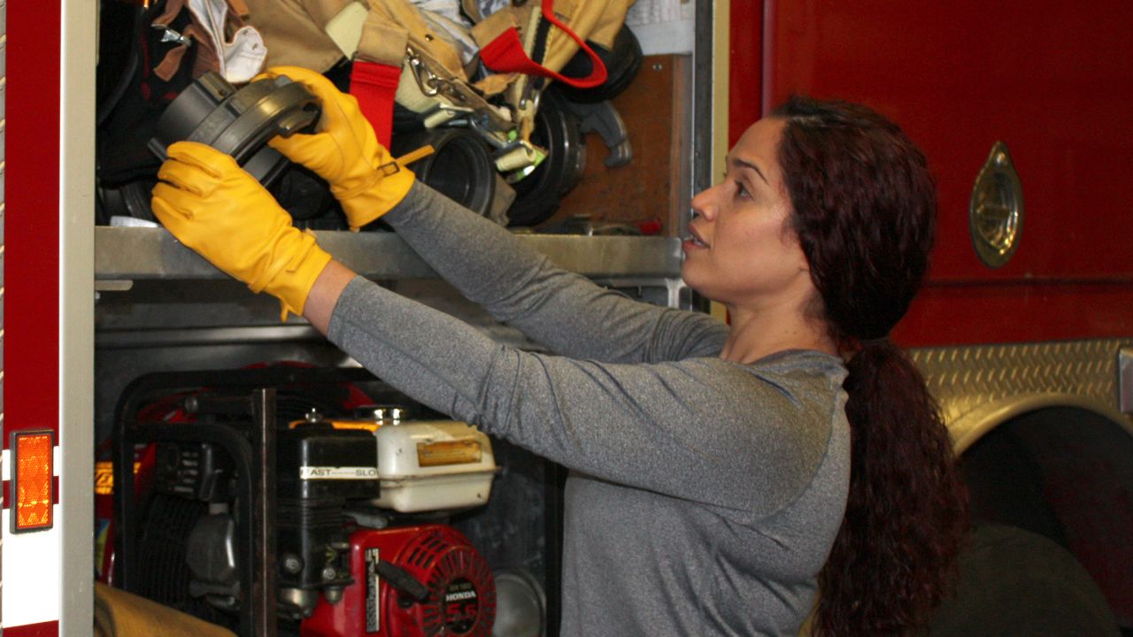 Vivi Rodriguez, a firefighter/paramedic with a large city fire department, wears SeeHerWork gloves on the job.