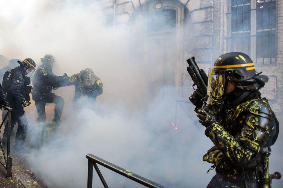 Riot police stand in tear gas in Toulouse, France, during a protest January 5.
