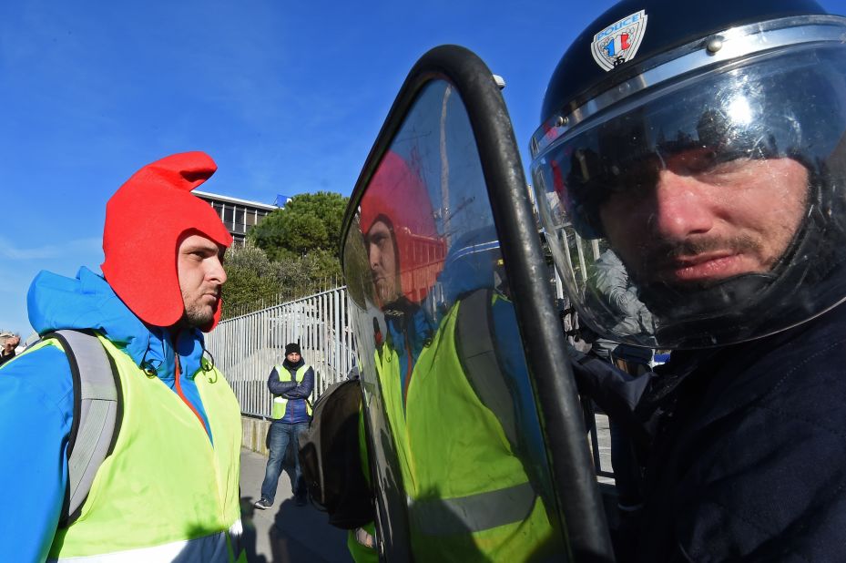 A yellow vest demonstrator faces riot police officers in Marseille, France, on Saturday, January 5, 2019.