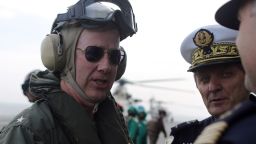 French Navy Rear Admiral Eric Chaperon (R), commander of the French Carrier Strike Group Task Force 473 and the aircraft carrier Charles de Gaulle, looks on as US Navy Rear Admiral Kevin M. Sweeney, Commander Carrier Strike Group Ten and the USS Harry S.Trumann (CVN 75) greets a crew member, as he visits his ship in the Gulf of Oman on January 30, 2014. The Charles de Gaulle and the USS Harry S.Trumann are conducting combined operations dubbed Bois Belleau.  AFP PHOTO / PATRICK BAZ        (Photo credit should read PATRICK BAZ/AFP/Getty Images)
