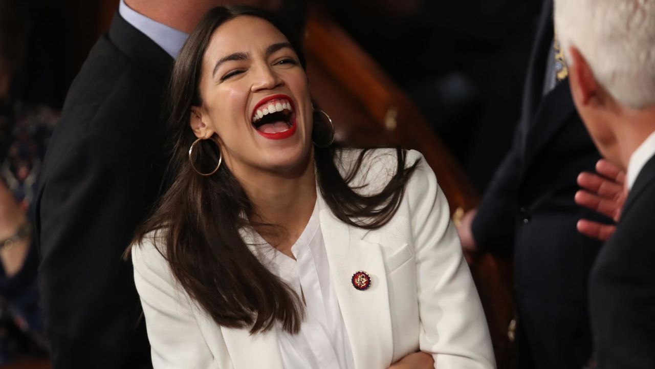 WASHINGTON, DC - JANUARY 03: Member elect Rep. Alexandria Ocasio-Cortez (D-NY) talks to fellow members of Congress during the first session of the 116th Congress at the U.S. Capitol January 03, 2019 in Washington, DC. Under the cloud of a partial federal government shutdown, Speaker of the House Rep. Nancy Pelosi (D-CA) reclaimed her former title as speaker and her fellow Democrats took control of the House of Representatives for the second time in eight years.(Photo by Win McNamee/Getty Images)