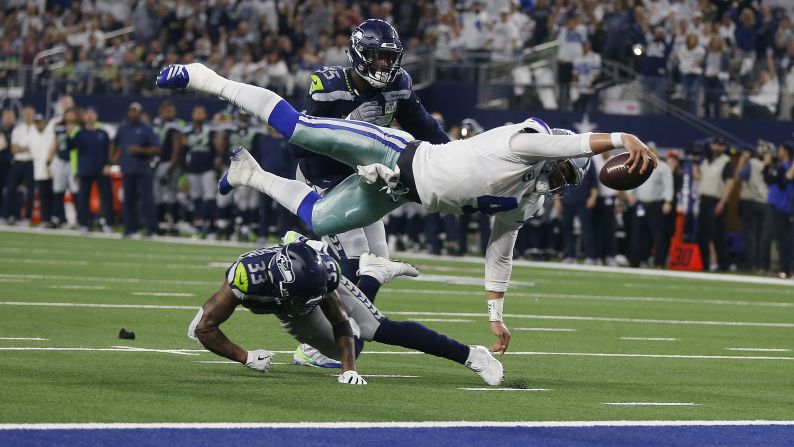 Dallas quarterback Dak Prescott reaches for a key first down late in the playoff game against Seattle on Saturday, January 5. Prescott and the Cowboys advanced to the next round with a 24-22 home victory.