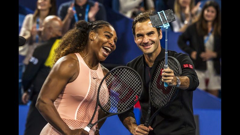 Tennis legends Serena Williams and Roger Federer take a selfie after playing in a mixed-doubles match on Tuesday, January 1. The Hopman Cup match was <a href="index.php?page=&url=https%3A%2F%2Fwww.cnn.com%2F2019%2F01%2F01%2Ftennis%2Fserena-federer-hopman-cup-clash-spt-intl%2Findex.html" target="_blank">the first time the two greats had ever competed against each other.</a> Federer and Belinda Bencic beat Williams and Frances Tiafoe.