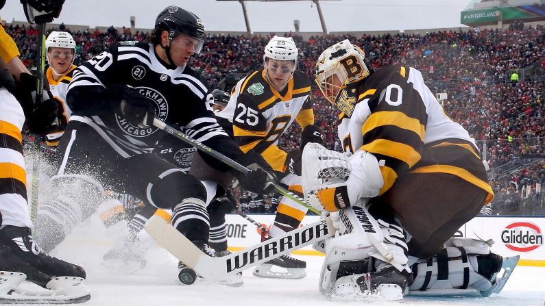 Boston goalie Tuukka Rask tries to corral a shot during the Winter Classic on Tuesday, January 1. This year, the annual outdoor game was played at Notre Dame Stadium in South Bend, Indiana.