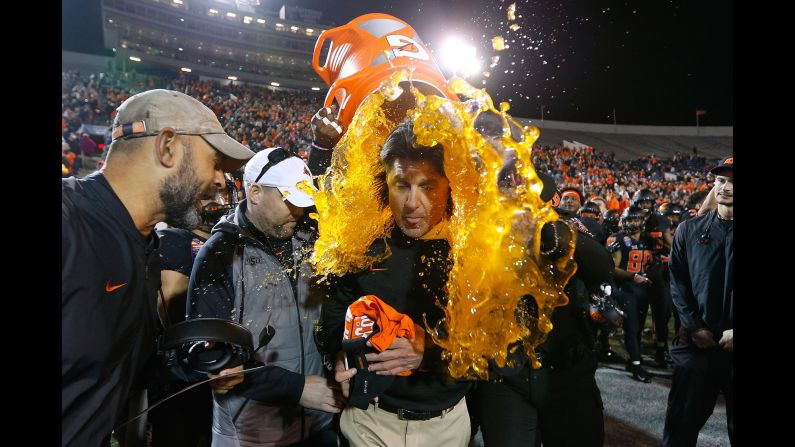 Oklahoma State head coach Mike Gundy is doused with Gatorade after his football team won the Liberty Bowl on Monday, December 31.