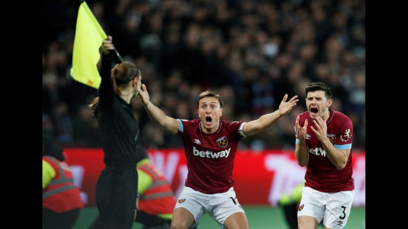 West Ham's Mark Noble, center, and Aaron Cresswell protest a call during a Premier League soccer match in London on Wednesday, January 2.