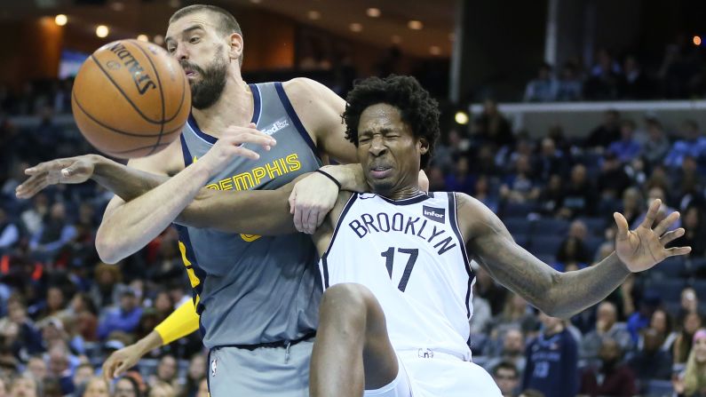 Brooklyn's Ed Davis is held by Memphis' Marc Gasol as they compete for a rebound during an NBA game on Friday, January 4.