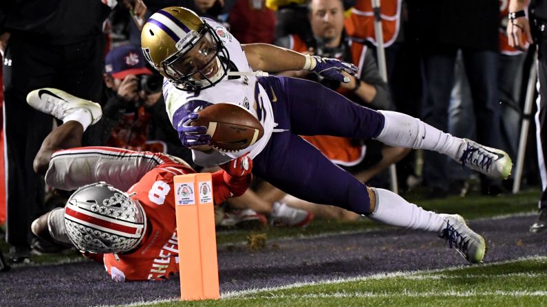 Washington's Myles Gaskin reaches over the goal line to score a touchdown in the Rose Bowl on Tuesday, January 1. 