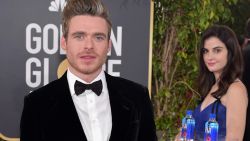 The Fiji Water girl strikes a pose behind Game of Thrones star Richard Madden