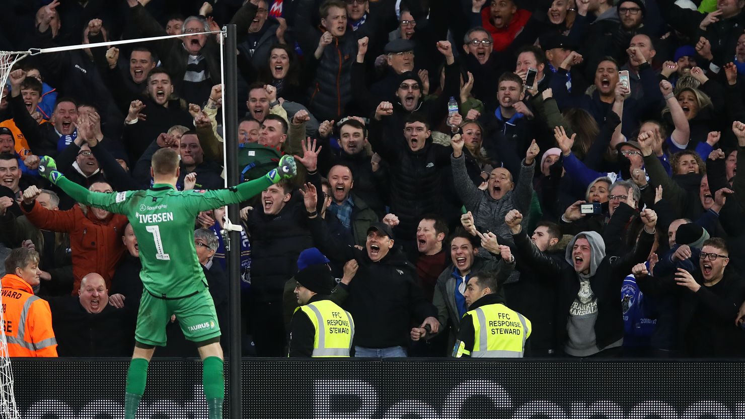 Oldham Athletic keeper Daniel Ivarsen celebrates saving a penalty from Fulahms' Aleksandar Mitrovic during their FA Cup Third Round match at Craven Cottage.