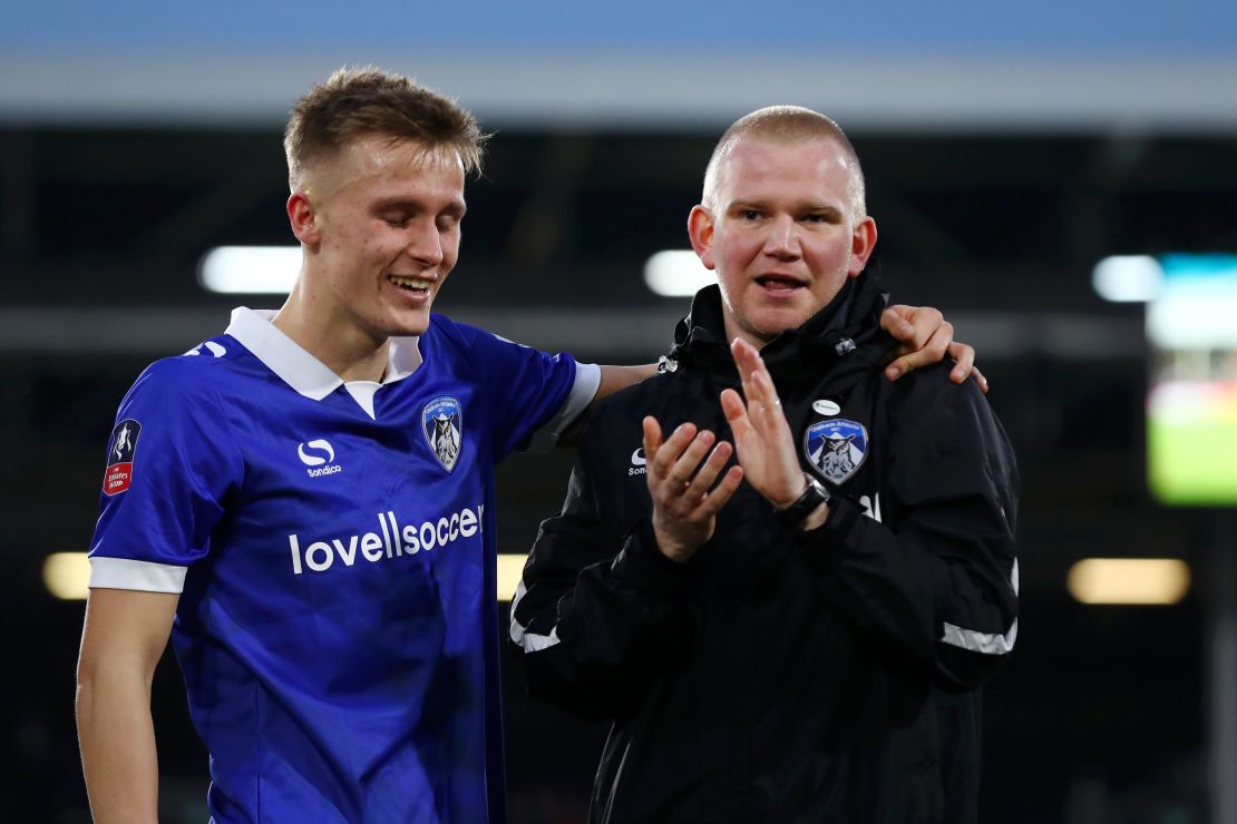Oldham manager Pete Wild celebrates with player Sam Surridge following Athletic's FA Cup thrid round victory.