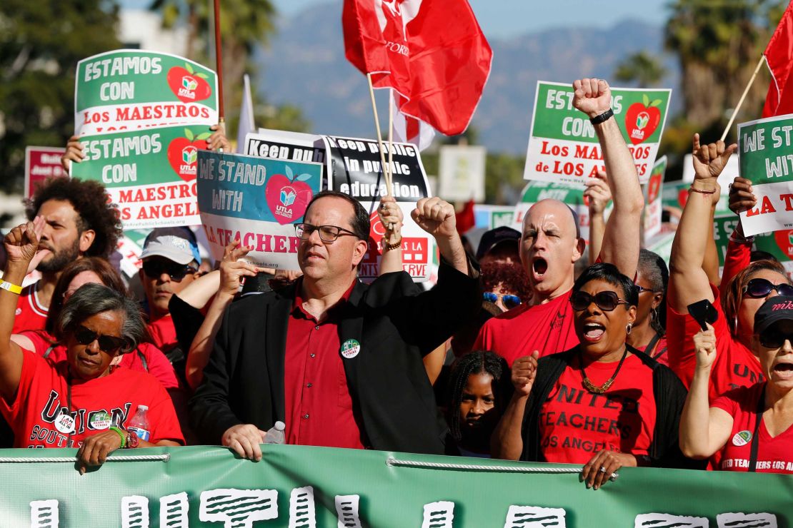 UTLA President Alex Caputo-Pearl, center, joins teachers at a rally December 15, 2018 in Los Angeles.