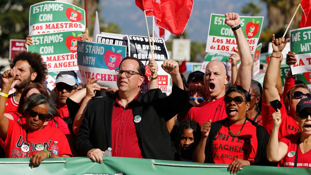 UTLA President Alex Caputo-Pearl, center, joins teachers at a rally December 15, 2018 in Los Angeles.