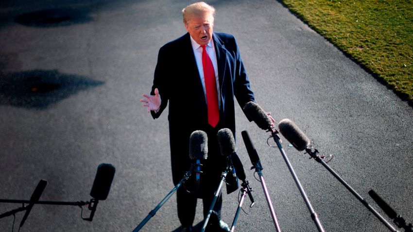 US President Donald Trump speaks to the press as he departs the White House in Washington, DC, on January 6, 2019, for meetings at Camp David. - President Donald Trump stood firm Sunday on his demand for billions of dollars to fund a border wall with Mexico, which has forced a shutdown of the US government now entering its third week."We have to build the wall," Trump told reporters as he left the  White House for the Camp David presidential retreat, while  conceding that the barrier could be "steel instead of concrete." (Photo by Jim WATSON / AFP)        (Photo credit should read JIM WATSON/AFP/Getty Images)
