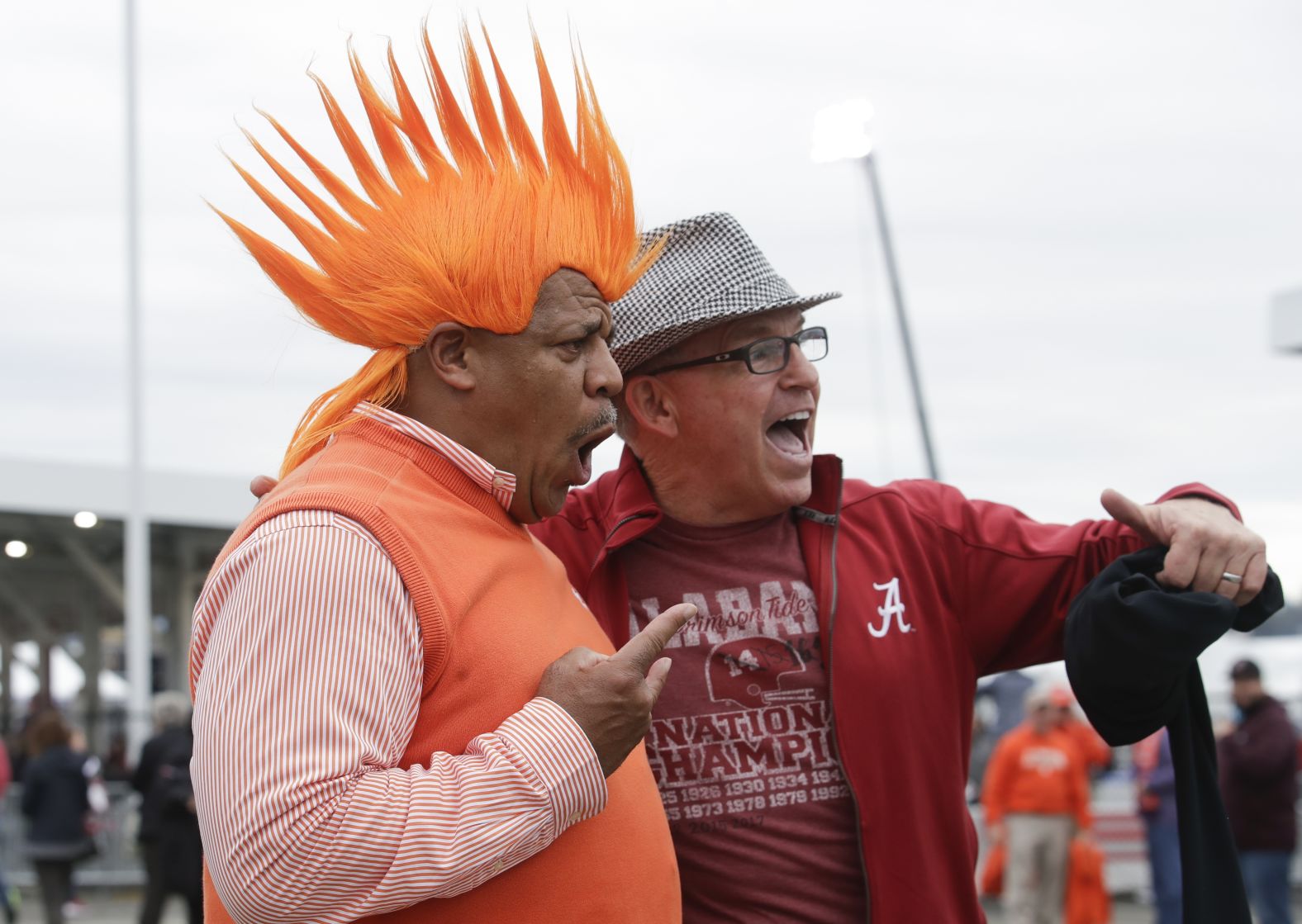 Fans Jerry Edwards and Bill Chase have some fun together before the game.