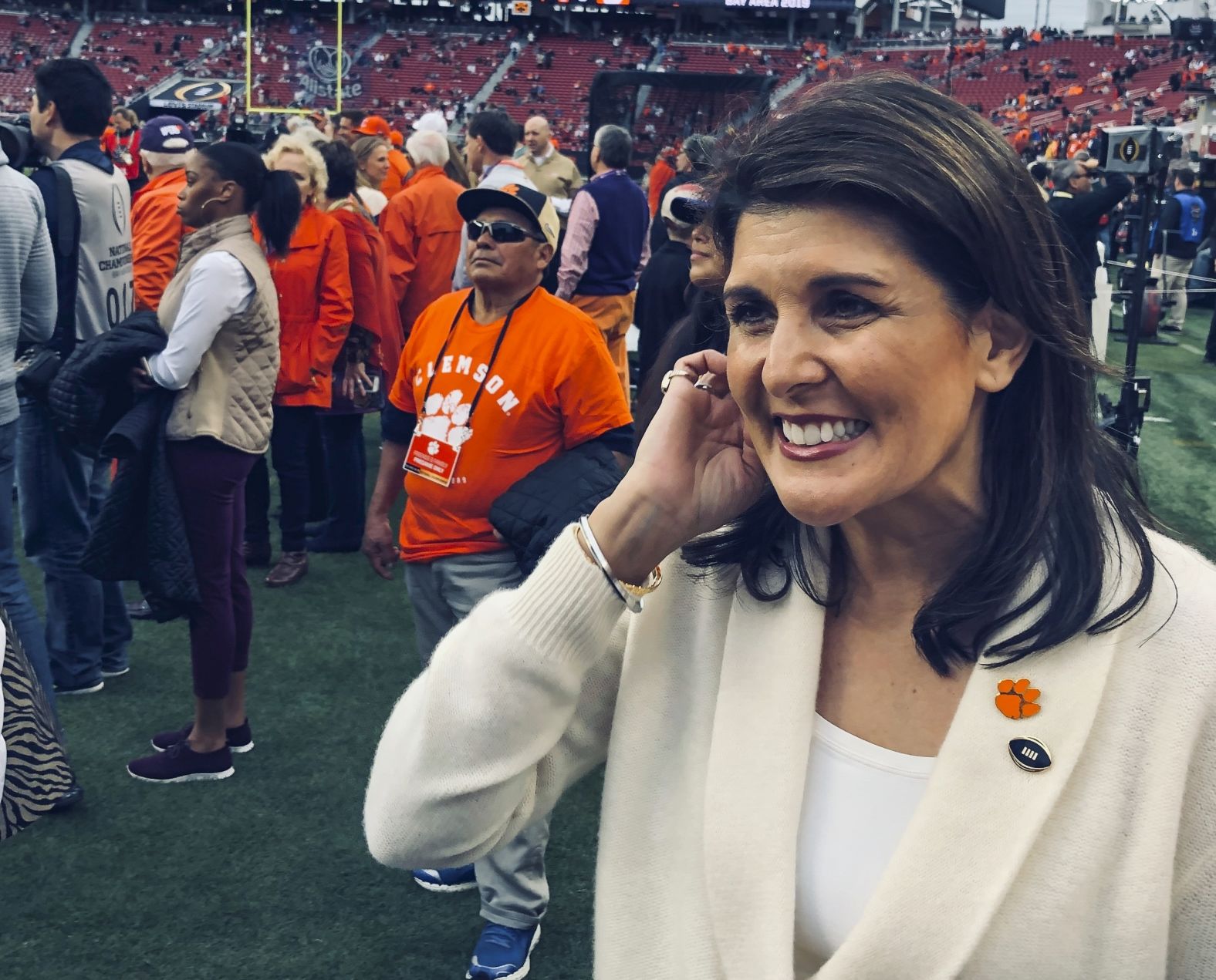 Nikki Haley, the former US ambassador to the United Nations, watches the teams warm up. Haley went to Clemson.