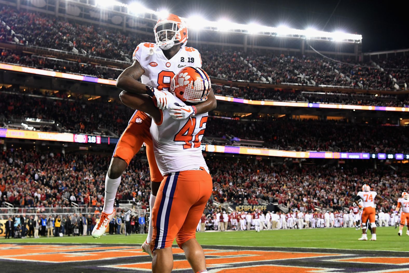 Clemson wide receiver Justyn Ross is held up by teammate Christian Wilkins after scoring on a 74-yard touchdown pass in the third quarter. The score gave the Tigers a 37-16 lead.