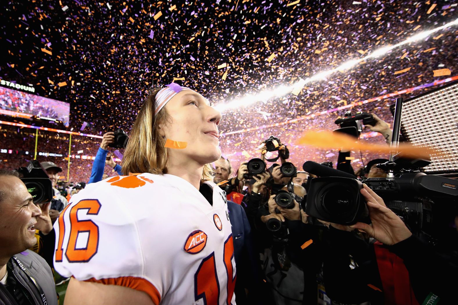 Lawrence is showered by confetti after the final whistle. The freshman quarterback took over the starting job during the middle of the season.