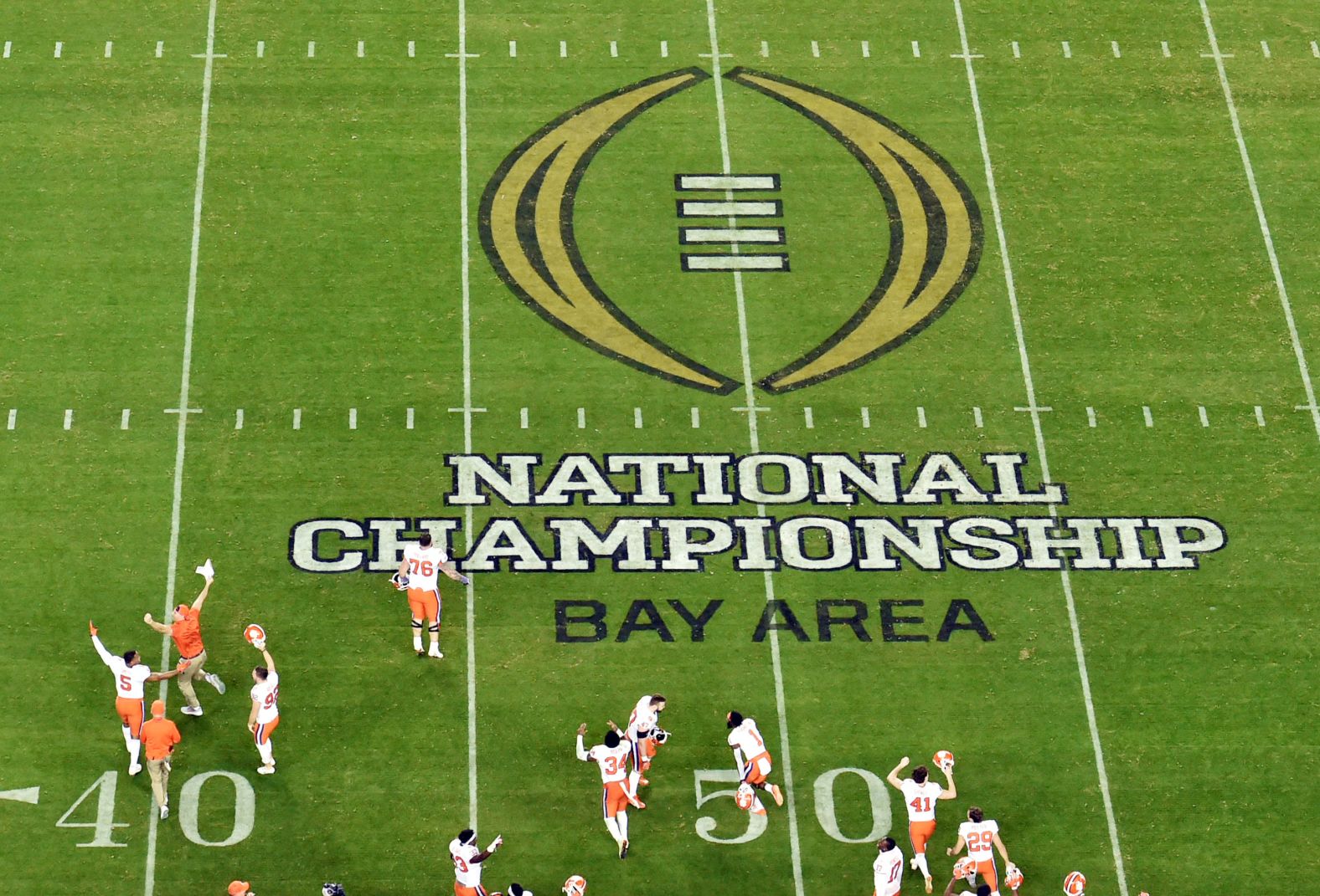 Clemson players rush the field at the end of the game.