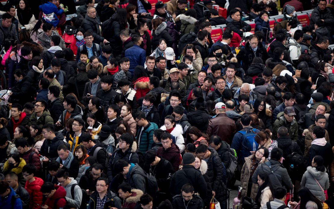 Passengers gather in the waiting hall at Hongqiao Railway Station ahead of the Lunar New Year holidays in 2018. The country's population is expected to decline by almost 200 million by mid-century.