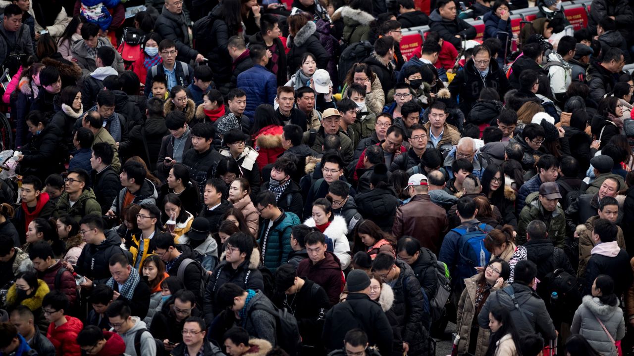 Passengers gather in the waiting hall at Hongqiao Railway Station ahead of the Lunar New Year holidays in 2018. The country's population is expected to decline by almost 200 million by mid-century.