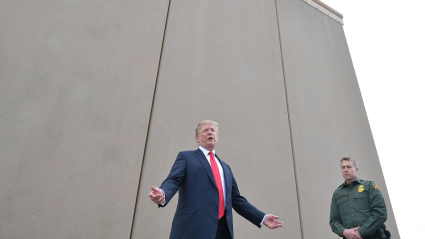 US President Donald Trump inspects border wall prototypes with Chief Patrol Agent Rodney S. Scott in San Diego, California on March 13, 2018. / AFP PHOTO / MANDEL NGAN        (Photo credit should read MANDEL NGAN/AFP/Getty Images)