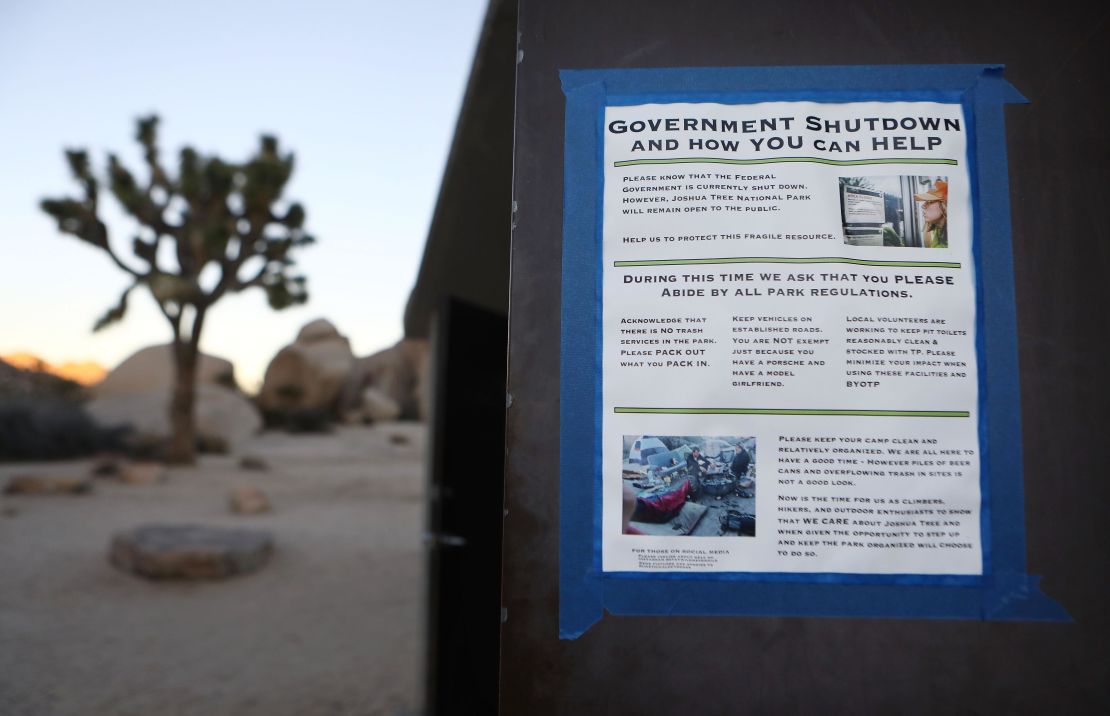 A sign placed by a volunteer is taped to a restroom door at Joshua Tree National Park on January 4, 2019 in Joshua Tree National Park, California. 