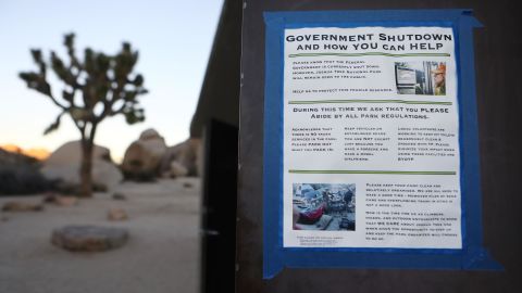 A sign placed by a volunteer is taped to a restroom door in Joshua Tree National Park on January 4.
