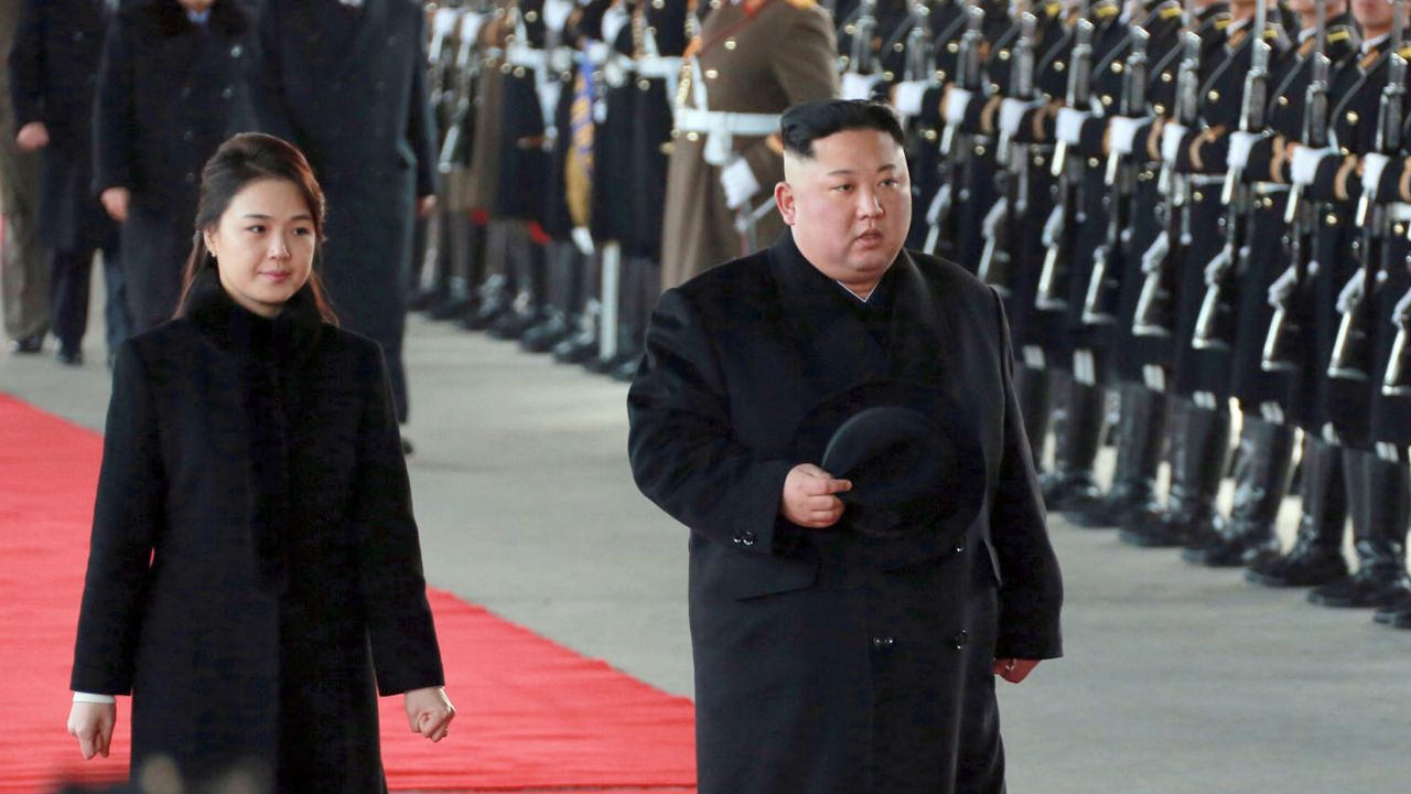 In this Monday, Jan. 7, 2019, photo provided on Tuesday, Jan. 8, 2019 by the North Korean government, North Korean leader Kim Jong Un walks with his wife Ri Sol Ju at Pyongyang Station in Pyongyang, North Korea, before leaving for China. Kim left for China for a four-day trip, the North's state media reported Tuesday, amid speculation that he may attempt to coordinate his positions with Beijing ahead of his likely summit with U.S. President Donald Trump. Independent journalists were not given access to cover the event depicted in this image distributed by the North Korean government. The content of this image is as provided and cannot be independently verified. Korean language watermark on image as provided by source reads: "KCNA" which is the abbreviation for Korean Central News Agency. (Korean Central News Agency/Korea News Service via AP)