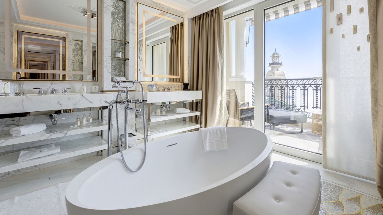 <strong>Hôtel de Paris Monte-Carlo -- </strong>Following a $280 million renovation, the new light-filled bathrooms are fitted with elegant marble and gold detailing, while you can enjoy Monaco's year-round balmy temperatures on the balcony outside. 