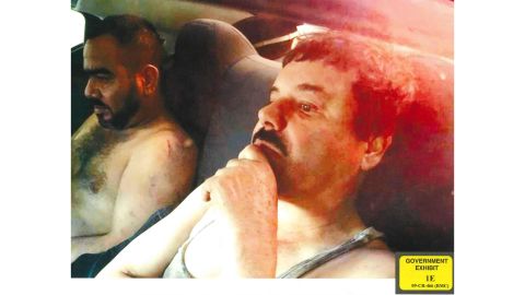 Joaquin "El Chapo" Guzman, wearing what appears to be a tank top, is pictured with an associate known as "Cholo Ivan."