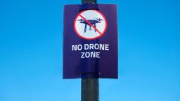 Drone in sky sign at Gatwick Airport flying not allowed or permitted air zone uk