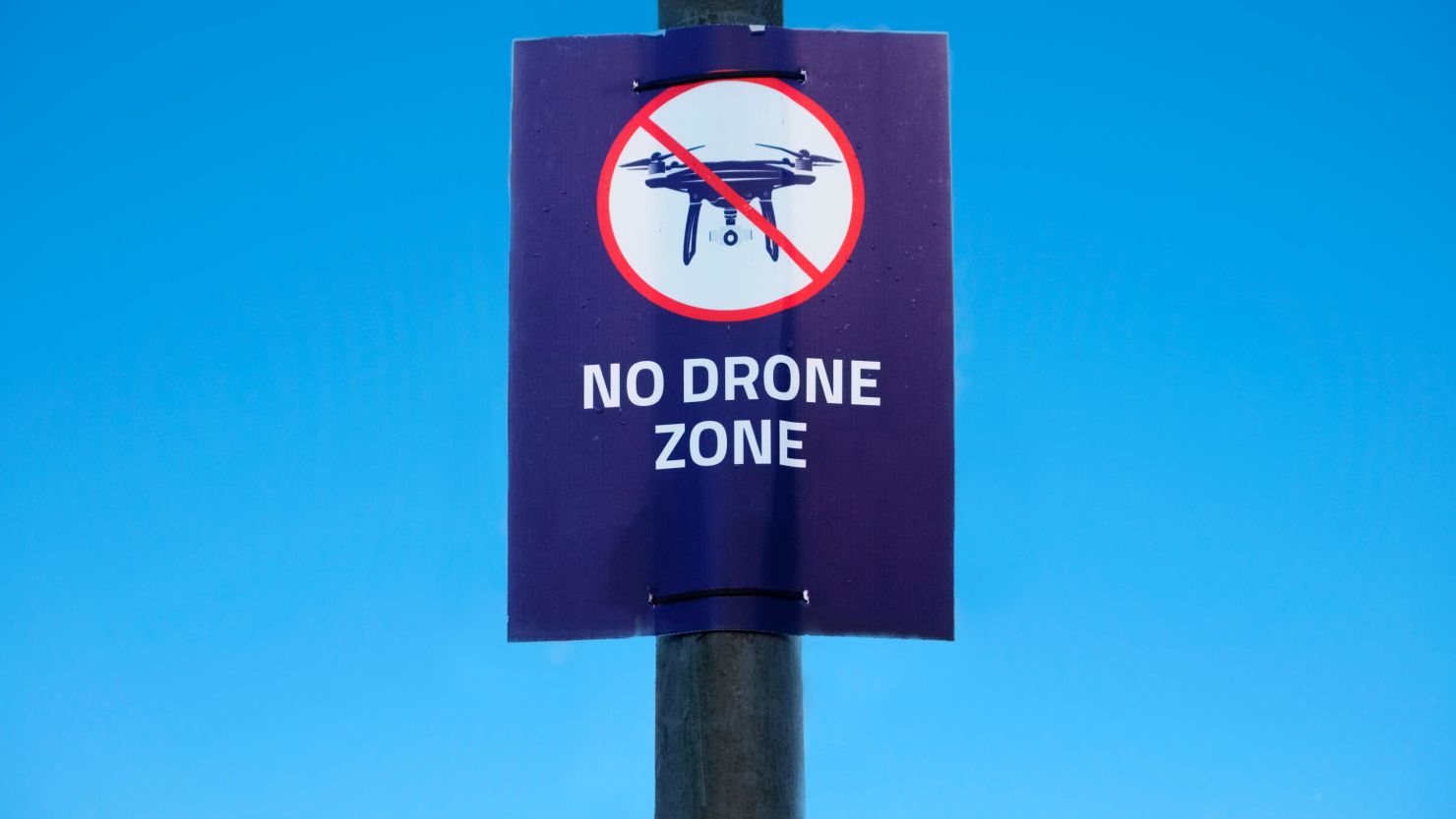 A "no drone zone" poster is seen at Gatwick Airport, which was brought to a halt for 36 hours in December following drone sightings.
