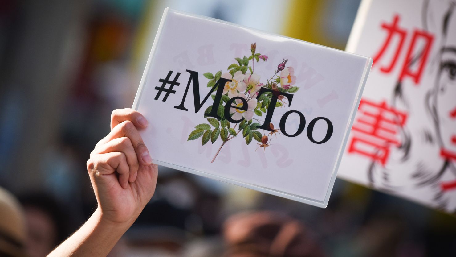 A demonstrator holds a sign during a rally against sexual harassment in Tokyo in April 2018.