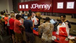 Employees assist customers at the checkout counter of a J.C. Penney Co. store at the Gateway Shopping Center in the Brooklyn borough of New York, U.S., on Saturday, Aug. 8, 2015. J.C. Penney Co. is scheduled to release earnings figures on Aug. 14. Photographer: Michael Nagle/Bloomberg via Getty Images