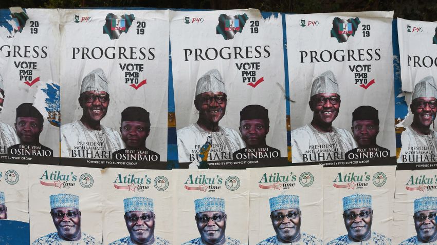 A picture shows campaign posters for Nigeria's incumbent president and candidate to his re-election for the ruling All Progressives Congress (APC) President Muhammadu Buhari, and Vice-President Yemi Osinbajo, placarded beside campaign posters for the presidential candidate of the opposition People's Democratic Party (PDP) Atiku Abubakar at a bus station in Lagos, on January 4, 2019, ahead of Nigeria's general elections of Ferbuary 16, 2019. (Photo by PIUS UTOMI EKPEI / AFP)        (Photo credit should read PIUS UTOMI EKPEI/AFP/Getty Images)