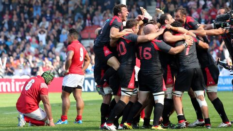 Georgia's players celebrate defeating Tonga at the 2015 World Cup.