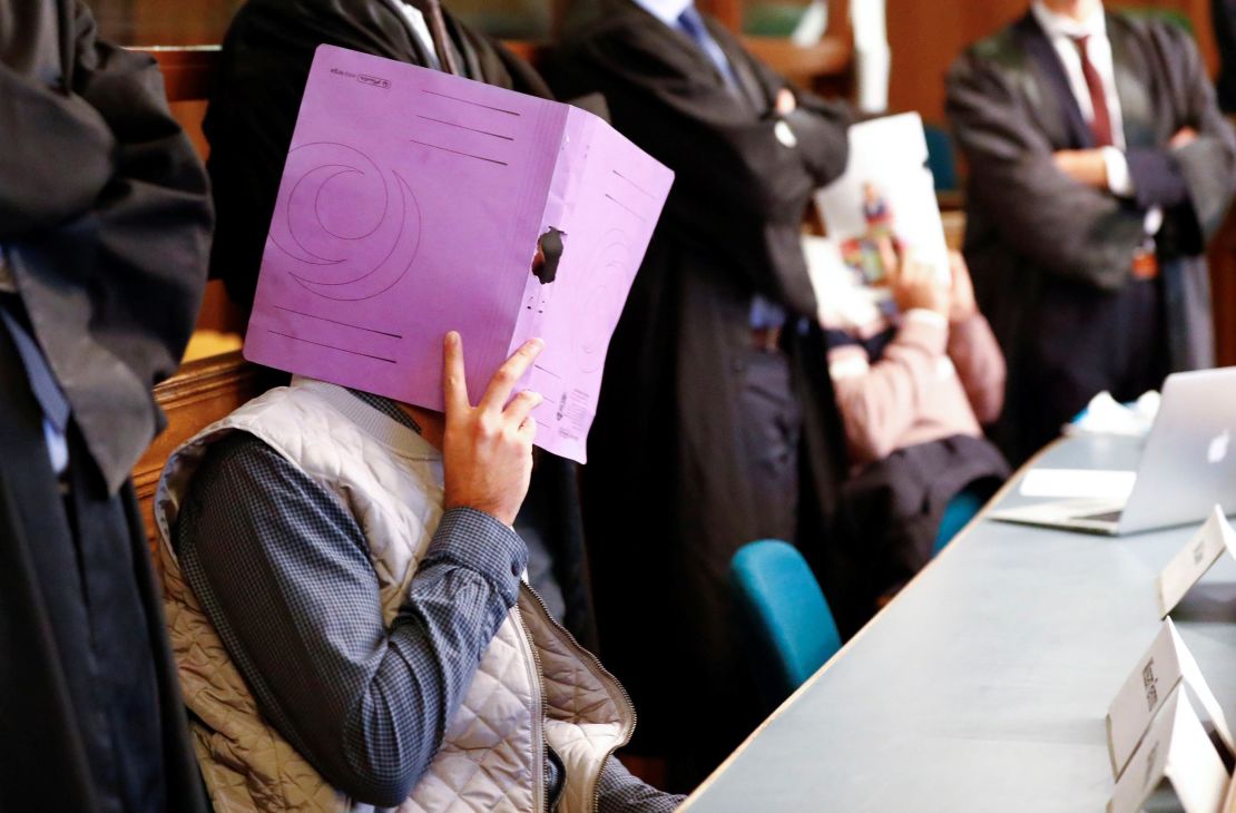The suspects, one of whom is shown here, went on trial on January 10.