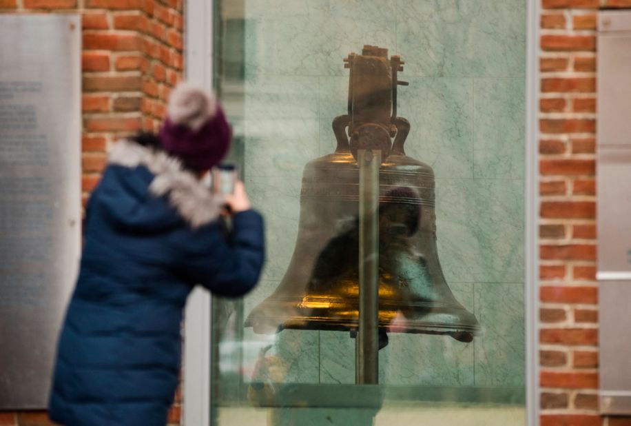 A tourist in Philadelphia takes a picture through a window of the closed building housing the Liberty Bell on January 8. 