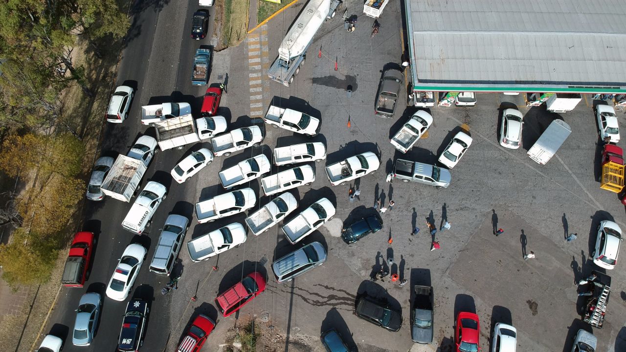 People line up to buy gasoline at a station in Morelia, Mexico, on January 7, 2019.