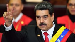 Venezuela's President Nicolas Maduro flashes the victory sign after being sworn-in for his second mandate, at the Supreme Court of Justice (TSJ) in Caracas on January 10, 2019. - Maduro begins a new term that critics dismiss as illegitimate, with the economy in free fall and the country more isolated than ever. (Photo by Yuri CORTEZ / AFP)        (Photo credit should read YURI CORTEZ/AFP/Getty Images)