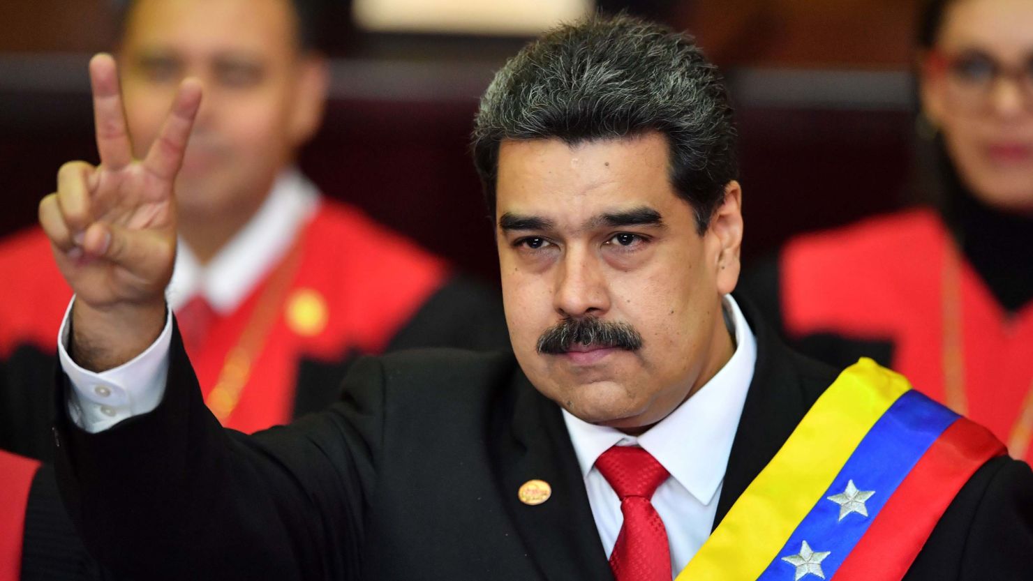 Venezuela's President Nicolas Maduro flashes a victory sign after being sworn in for his second term in Caracas on Thursday.