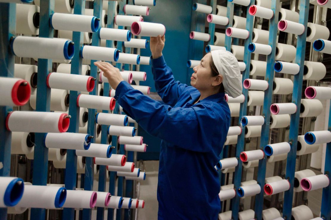 A woman working at a textile factory in Haian, Jiangsu, China. In December, prices of Chinese manufactured goods rose at a much slower pace than expected. 