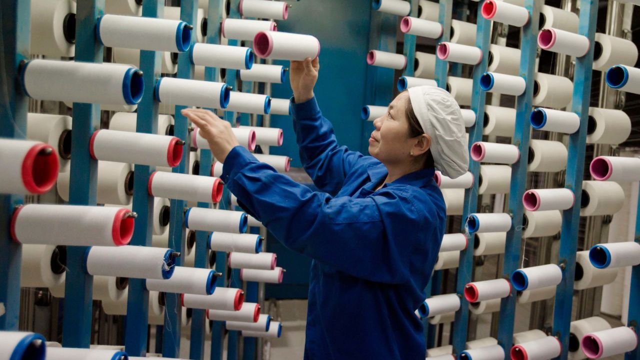 A woman working at a textile factory in Haian, Jiangsu, China. In December, prices of Chinese manufactured goods rose at a much slower pace than expected.