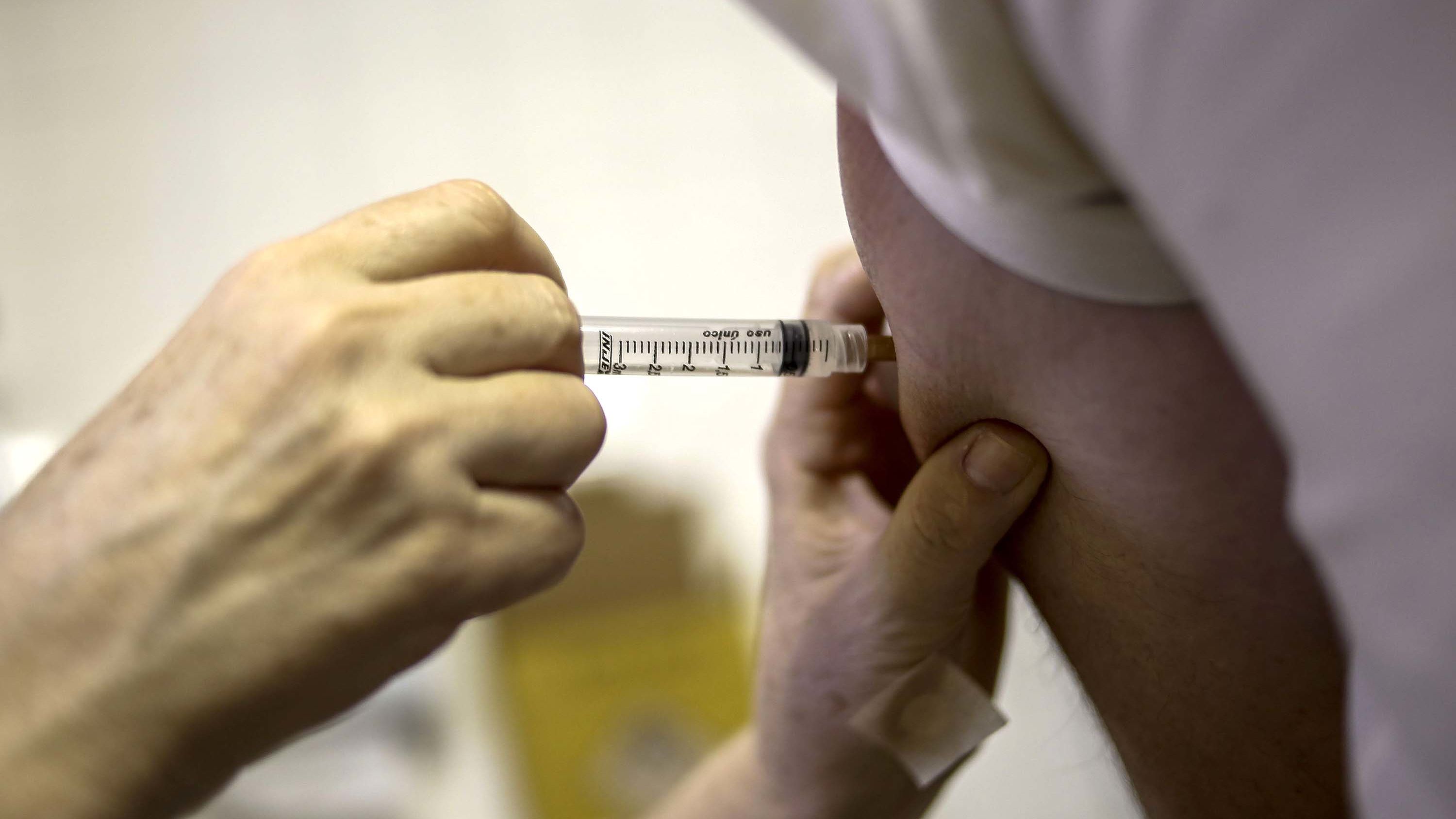 A woman receives a yellow fever vaccination at an outpatient clinic in Sao Paulo, Brazil.