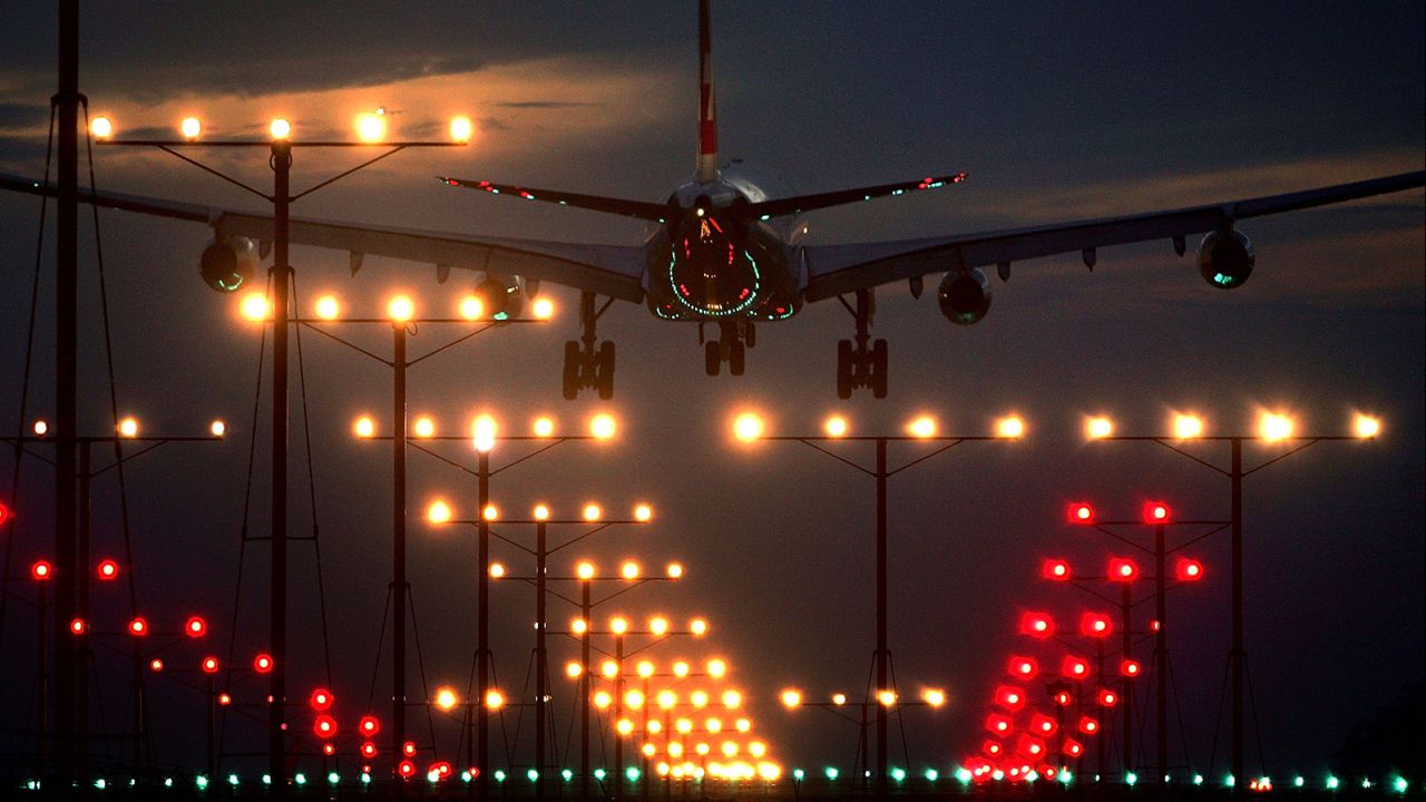 LOS ANGELES, CA - NOVEMBER 22: A jet lands at Los Angeles International Airport (LAX) on Thanksgiving eve, traditionally the busiest travel day of the year, November 22, 2006 in Los Angeles, California. The American Automobile Association (AAA) estimated 38.3 million people will travel 50 miles or more for Thanksgiving, and that 4.8 million travelers will fly to their Thanksgiving destinations. (Photo by David McNew/Getty Images)