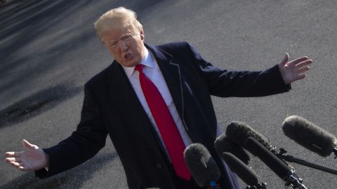 US President Donald Trump speaks as he departs the White House in Washington, DC, on January 6, 2019, for meetings at Camp David. - President Donald Trump stood firm Sunday on his demand for billions of dollars to fund a border wall with Mexico, which has forced a shutdown of the US government now entering its third week."We have to build the wall," Trump told reporters as he left the White House for the Camp David presidential retreat, while conceding that the barrier could be "steel instead of concrete." (Photo by Jim WATSON / AFP) (Photo credit should read JIM WATSON/AFP/Getty Images)