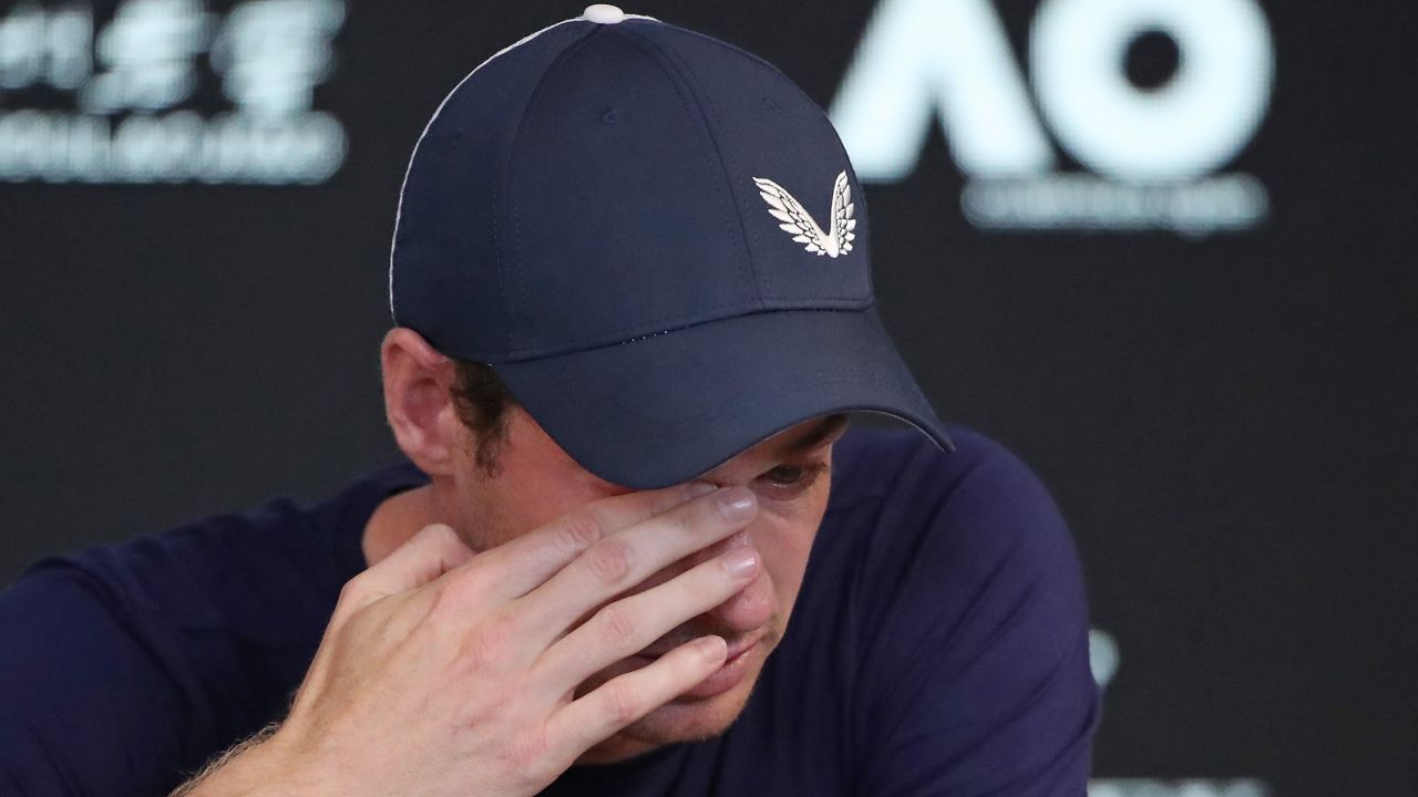 Andy Murray wipes away tears as he announces his retirement from tennis.
