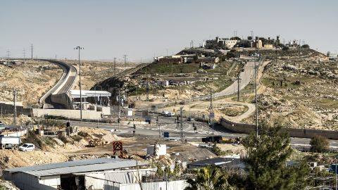 A small Israeli settlement is perched on a hill behind the newly constructed Route 4370.